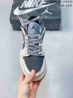 Front view showing perforated toe panel and gray laces