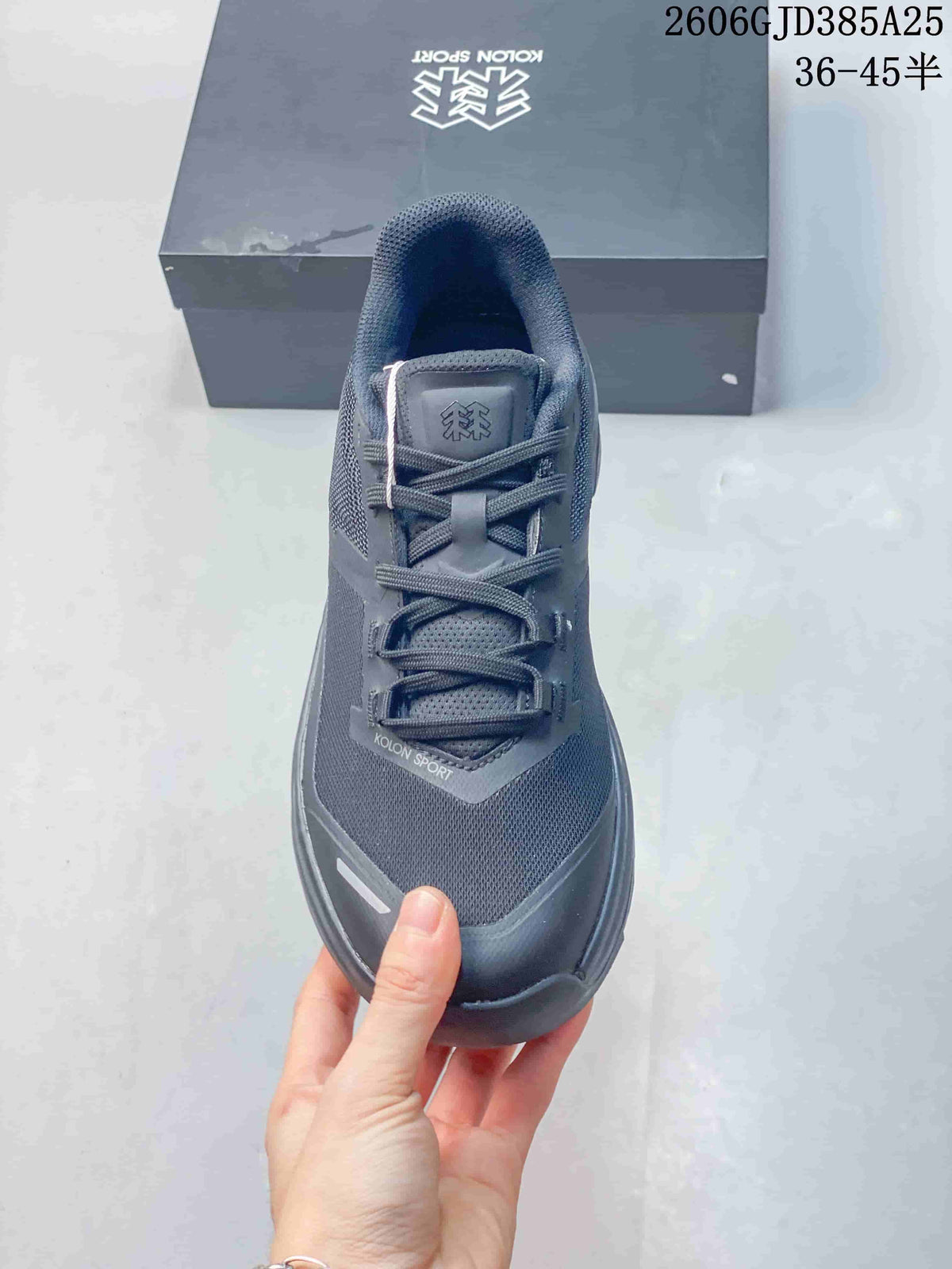 Top view highlighting the laces, tongue and mesh-style upper of the charcoal shoe.