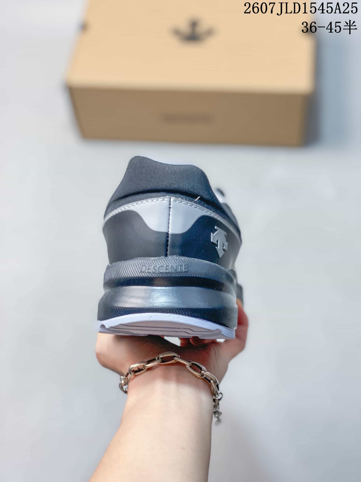 Rear view of the gray and black sneaker showing the padded heel collar, layered sole, and DESCENTE branding.