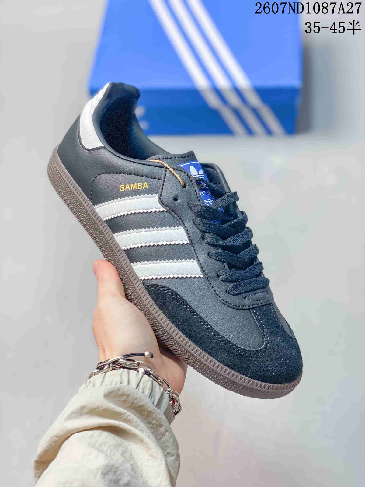Black and white adidas Samba sneaker with white stripes, dark laces and a gum-look sole.