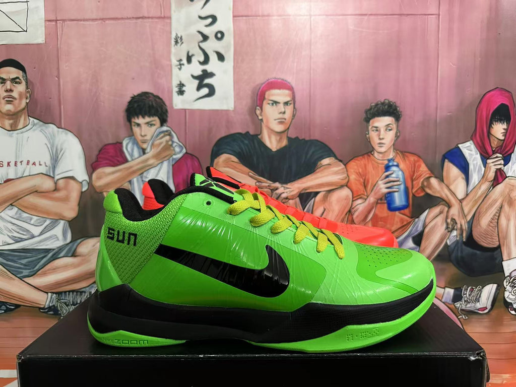 Side view of the green Nike basketball shoe with black Swoosh detailing and a visible Zoom marking.