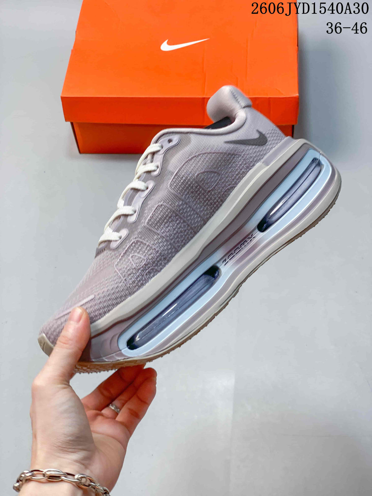 Side view highlighting the mesh-patterned upper and visible air-filled sole sections