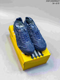 Pair of deep blue ASICS MEXICO 66 SD PARATY sneakers displayed on a yellow shoe box.