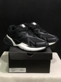 Pair of black and white AMIRI MA Runner sneakers displayed on a black shoebox, with the box label showing size 41.