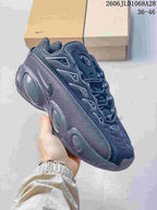Angled side view of the dark sneaker with contrasting accents.