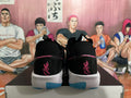 Rear view of black Nike GT Cut 3 shoes with pink details and blue outsole accents