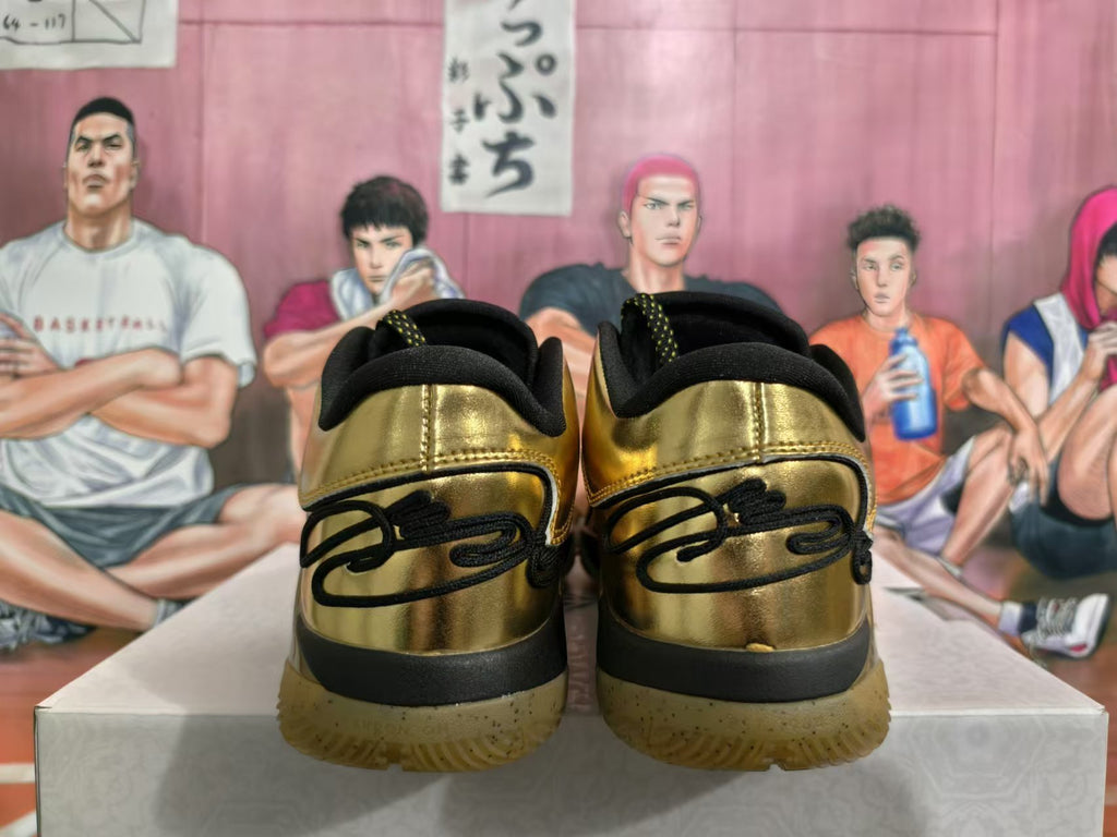 Rear view of gold-tone Nike basketball sneakers with black heel details and translucent gum-colored soles.