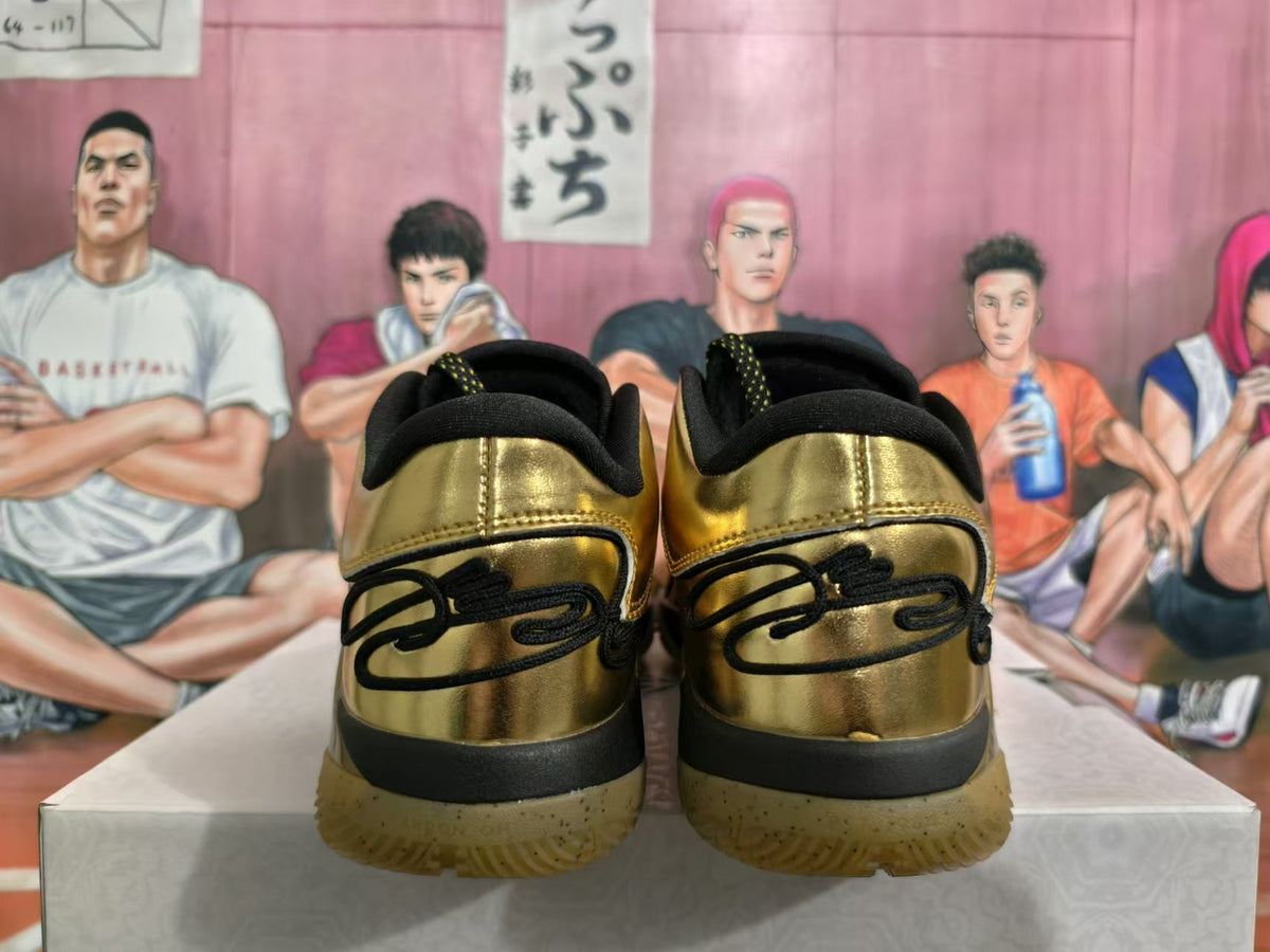 Rear view of gold-tone Nike basketball sneakers with black heel details and translucent gum-colored soles.