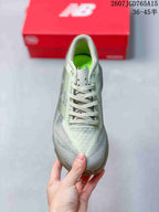 Top view of the gray running shoe showing the lace-up design, tongue, and textured toe area.