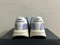 Rear view of New Balance U370 sneakers showing white heel panels and gray accents
