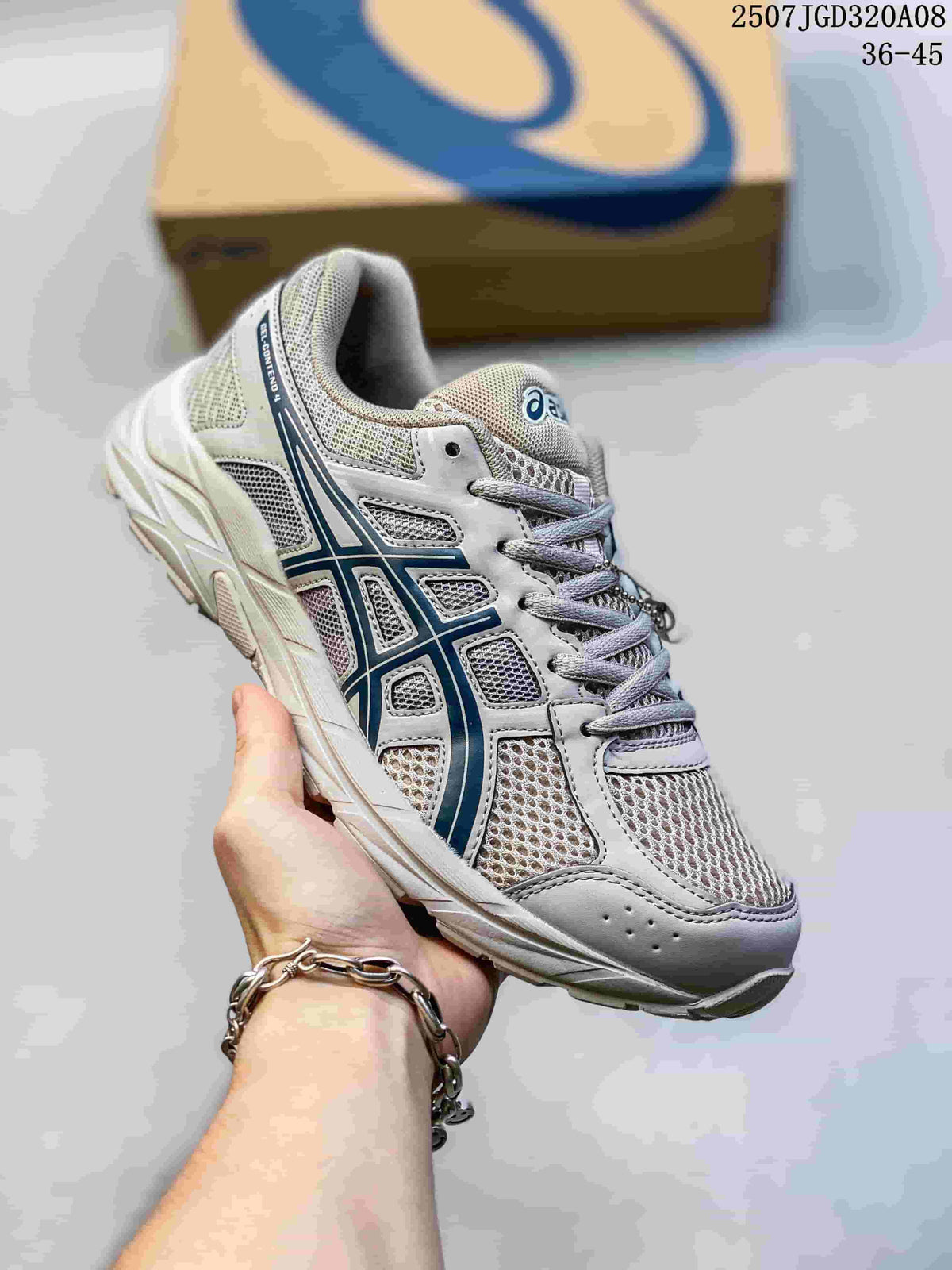 Angled side view of the gray ASICS sneaker with blue branding and mesh panels.