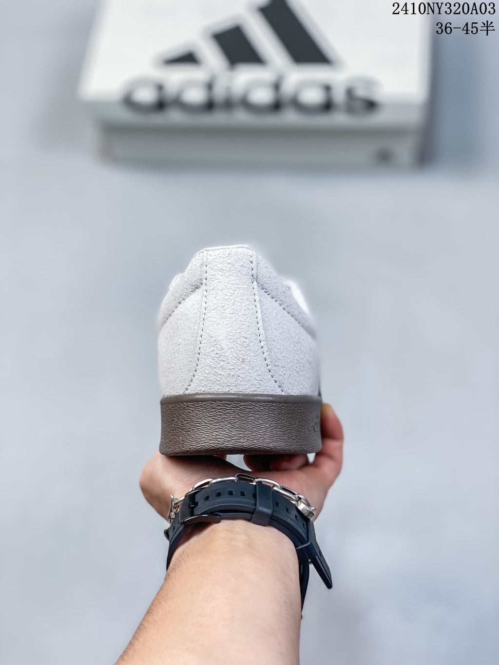 Rear view showing the white heel section and brown-colored outsole.