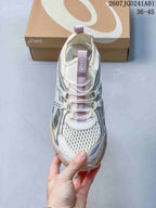Top view showing the mesh-look toe panel, laces, and lilac tongue detail of an ASICS GT-2160 Breeze sneaker