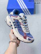 Angled side view showing the blue mesh upper, cream overlays, burgundy details and three side stripes.