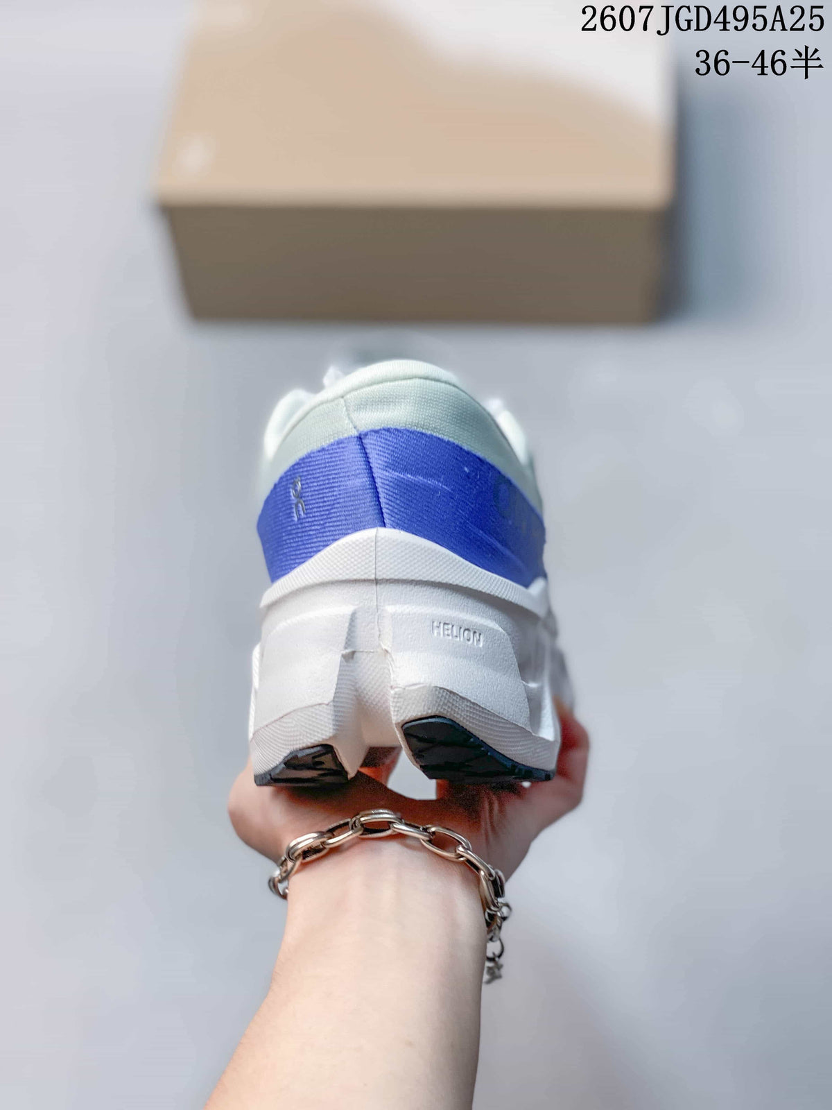Rear view showing the blue heel panel and sculpted white sole