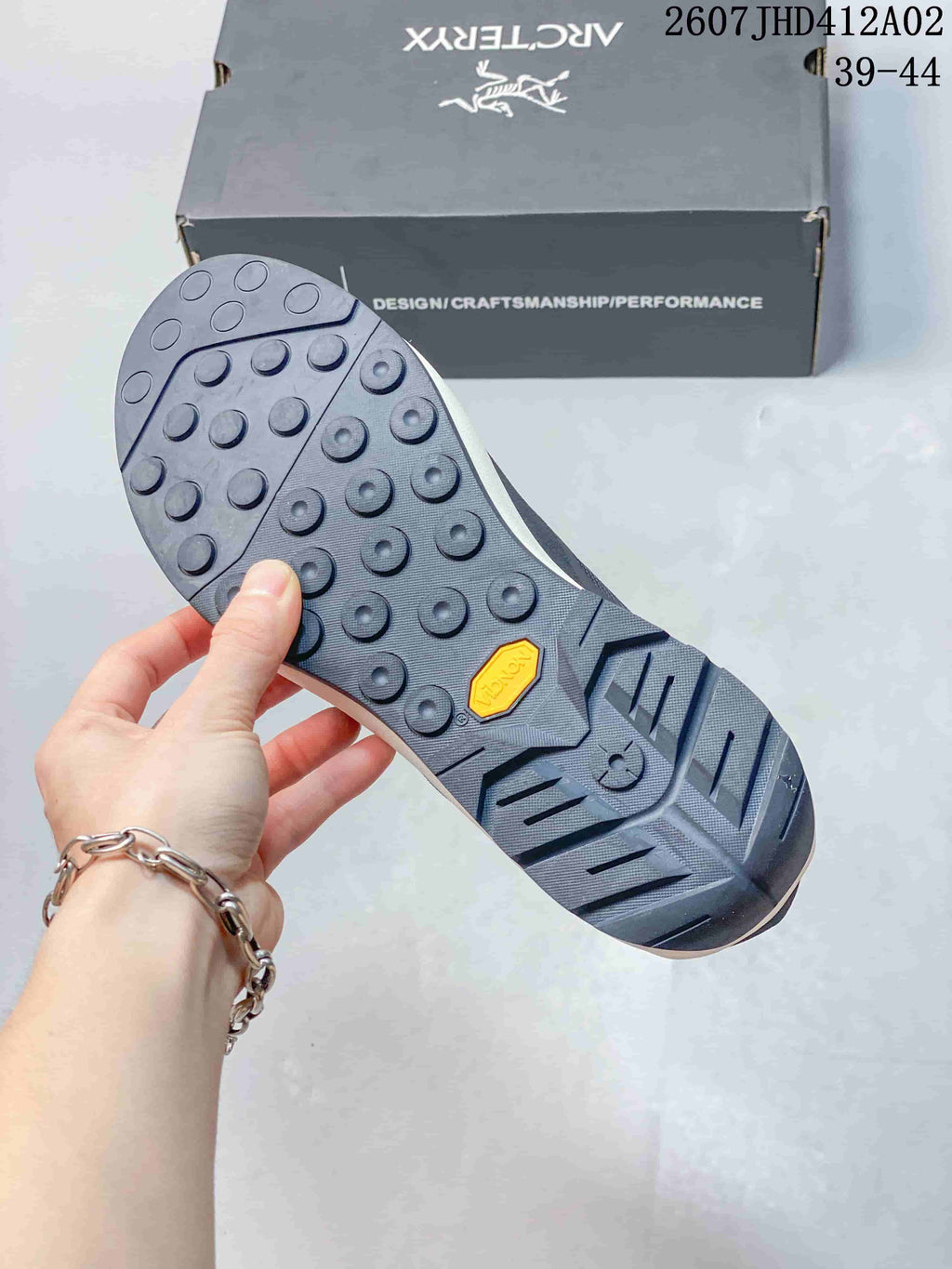Close-up of the shoe outsole with circular tread details