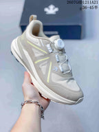 Side and top view of an off-white DESCENTE sneaker with layered panels and a BOA dial closure.