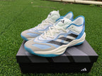 Pair of white and blue Adidas Adizero shoes shown from the front and side.