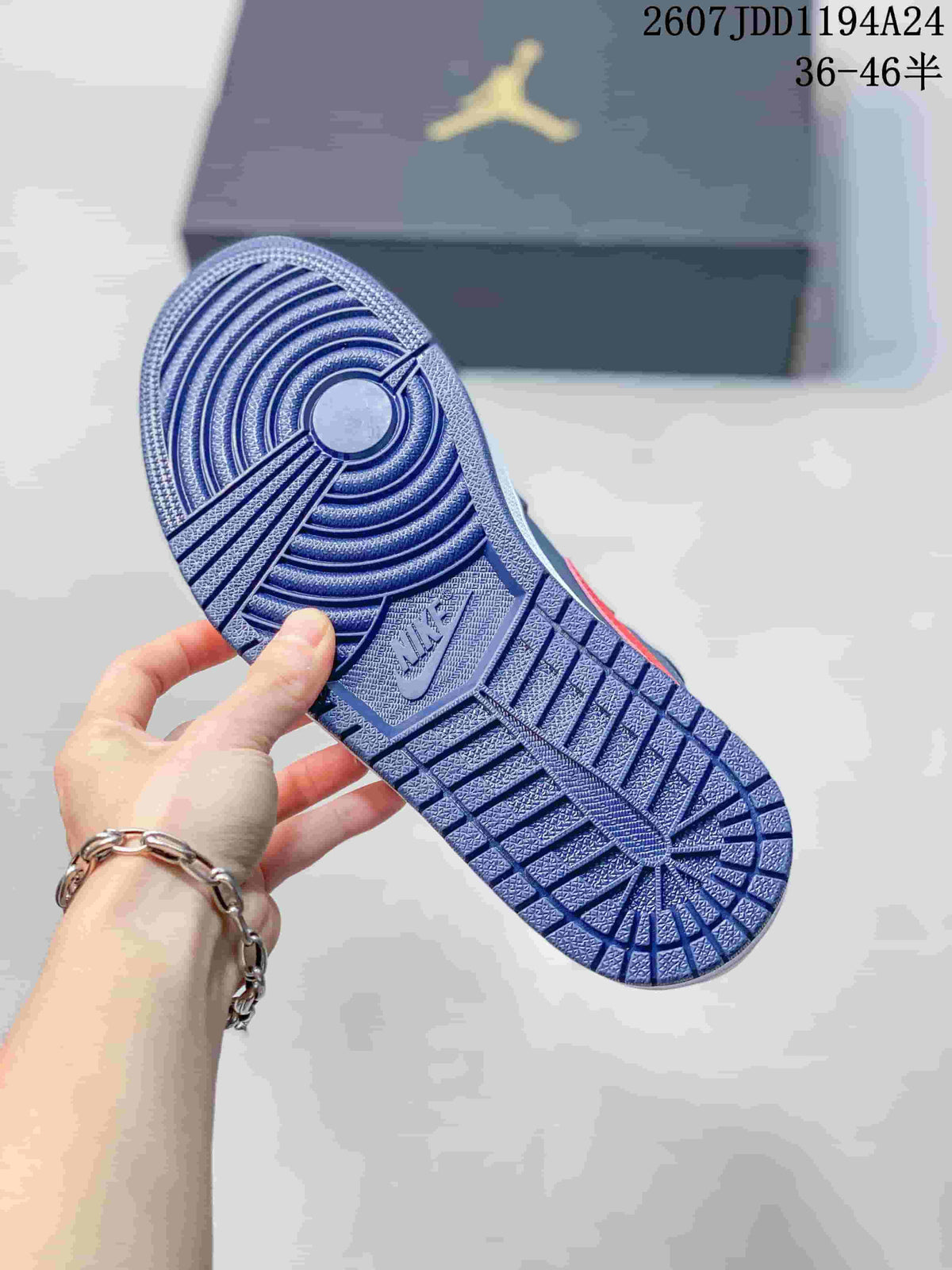 Underside view showing the navy patterned outsole of a Jordan low-top sneaker.