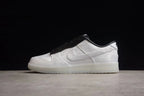 Side profile highlighting the white upper, tonal Swoosh, black collar, and white outsole.