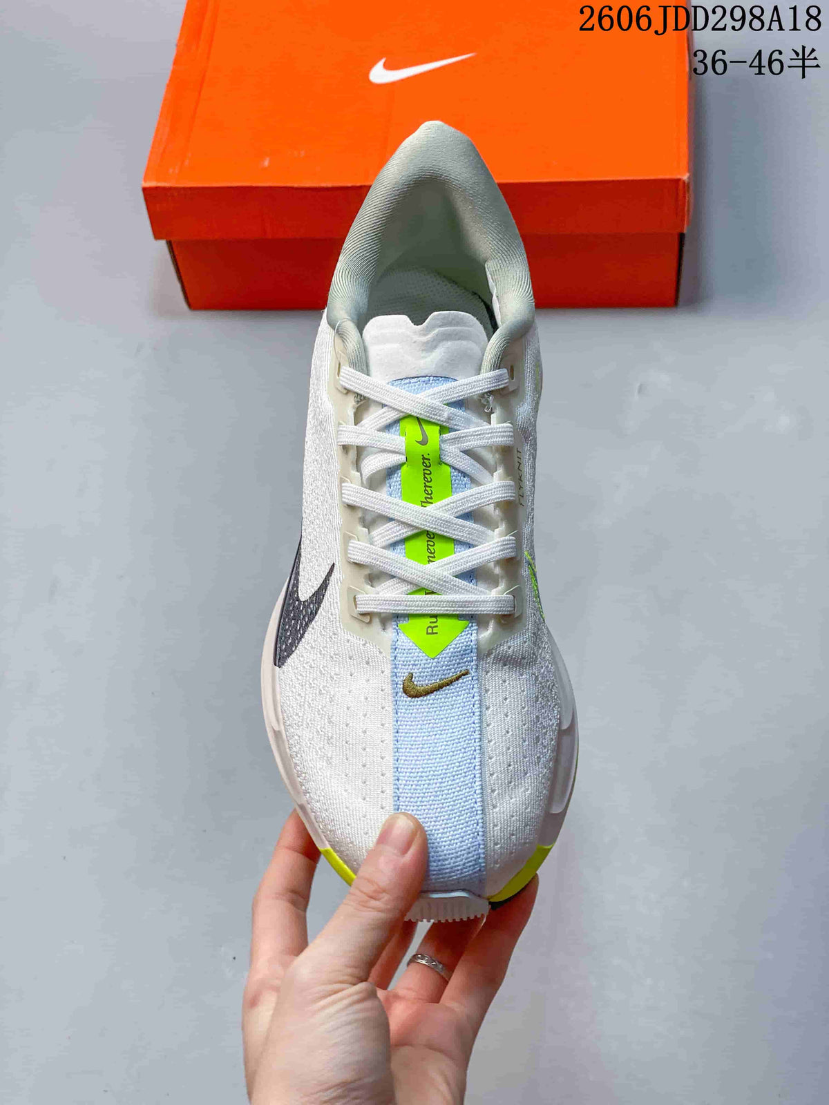 Top view showing the lace-up construction, pale blue center panel, white upper, and lime tongue detail.