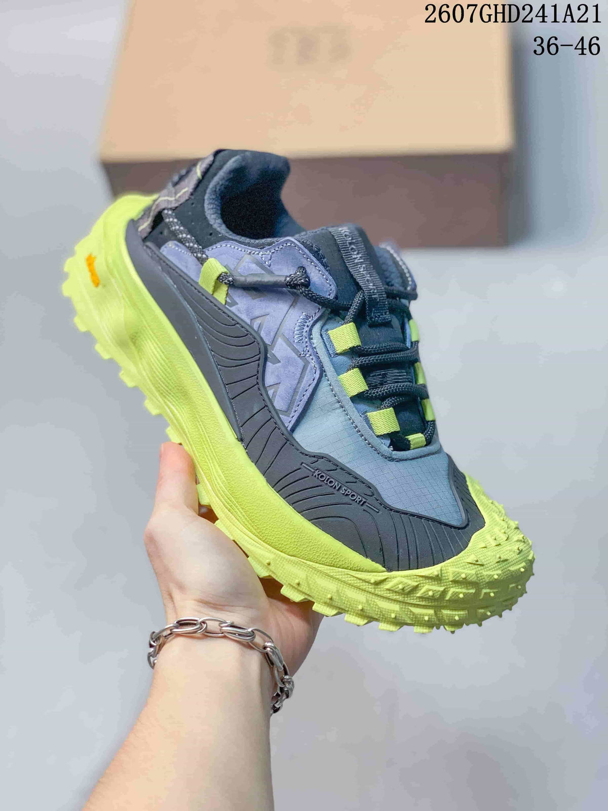 KOLON SPORT LIT CAMP sneaker in blue-gray with bright lime-green outsole and lace accents.