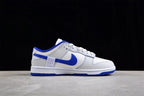 Side profile of a white and blue low-top sneaker with blue side branding and a white midsole.