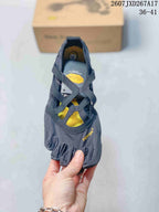 Top view showing the five separate toe compartments, yellow interior panels, and crossover straps.