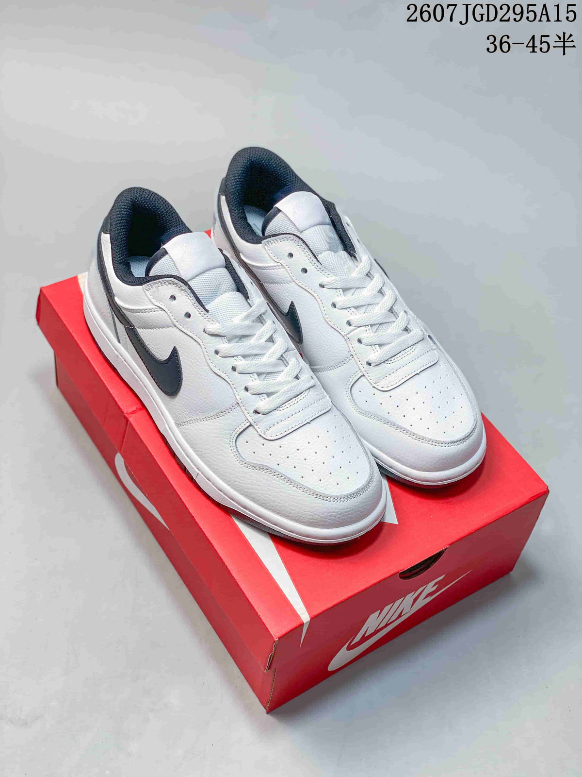 Pair of white and black Nike SB Dunk Low Pro sneakers displayed on a red shoebox; visible overlay reads style code 2607TGD295A15 and size range 36–45 half sizes.