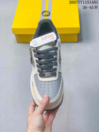 Top view showing perforated gray toe panels and dark patterned laces.