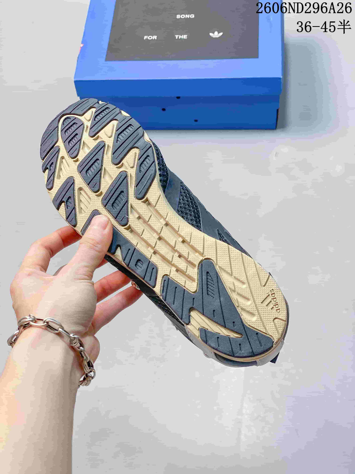 Close-up of the sneaker outsole showing a contrasting cream-and-dark tread pattern.