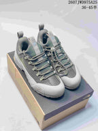 Pair of gray The North Face trail sneakers displayed on a shoebox, with model code 2607JWD975A25 and size range 36–45 shown above.