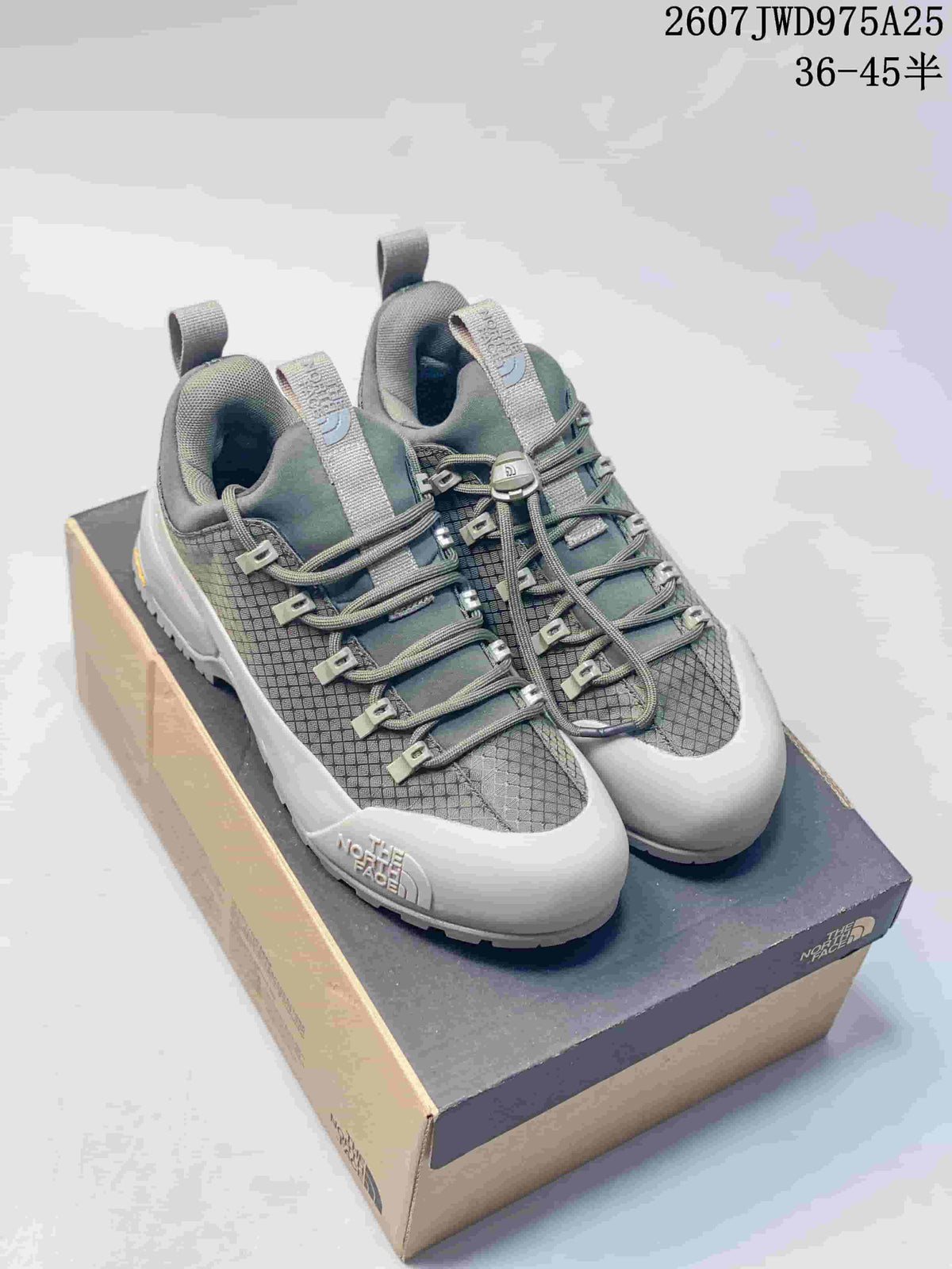 Pair of gray The North Face trail sneakers displayed on a shoebox, with model code 2607JWD975A25 and size range 36–45 shown above.