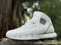 Side view of a white Nike Zoom Huarache 2K5 high-top sneaker