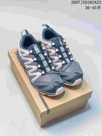 Pair of ash gray Salomon XA Pro 3D sneakers displayed on a shoebox; source image text shows code 2607JXD383A23 and size range 36–45.