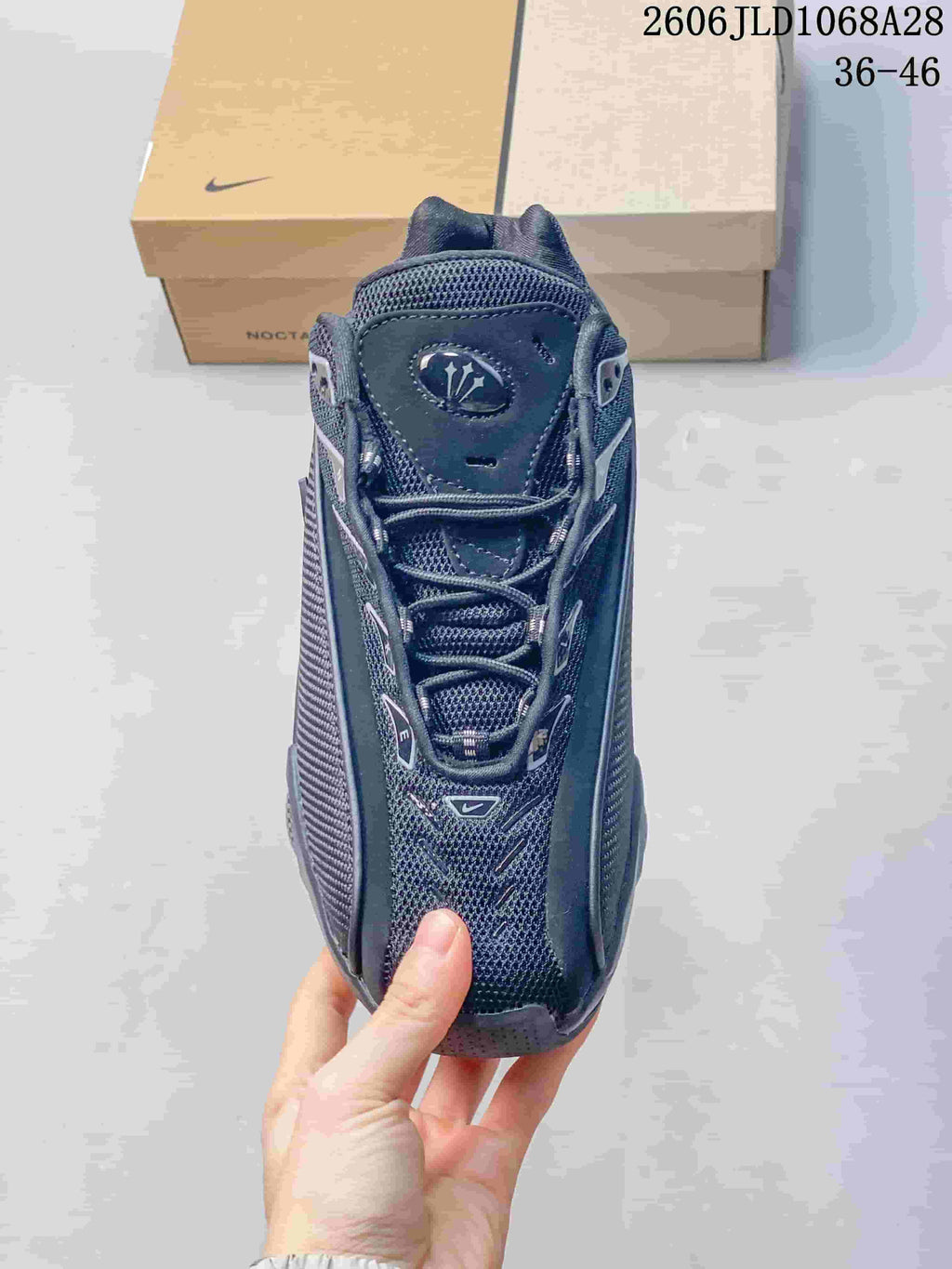 Front view of the lace-up sneaker with mesh-like detailing.