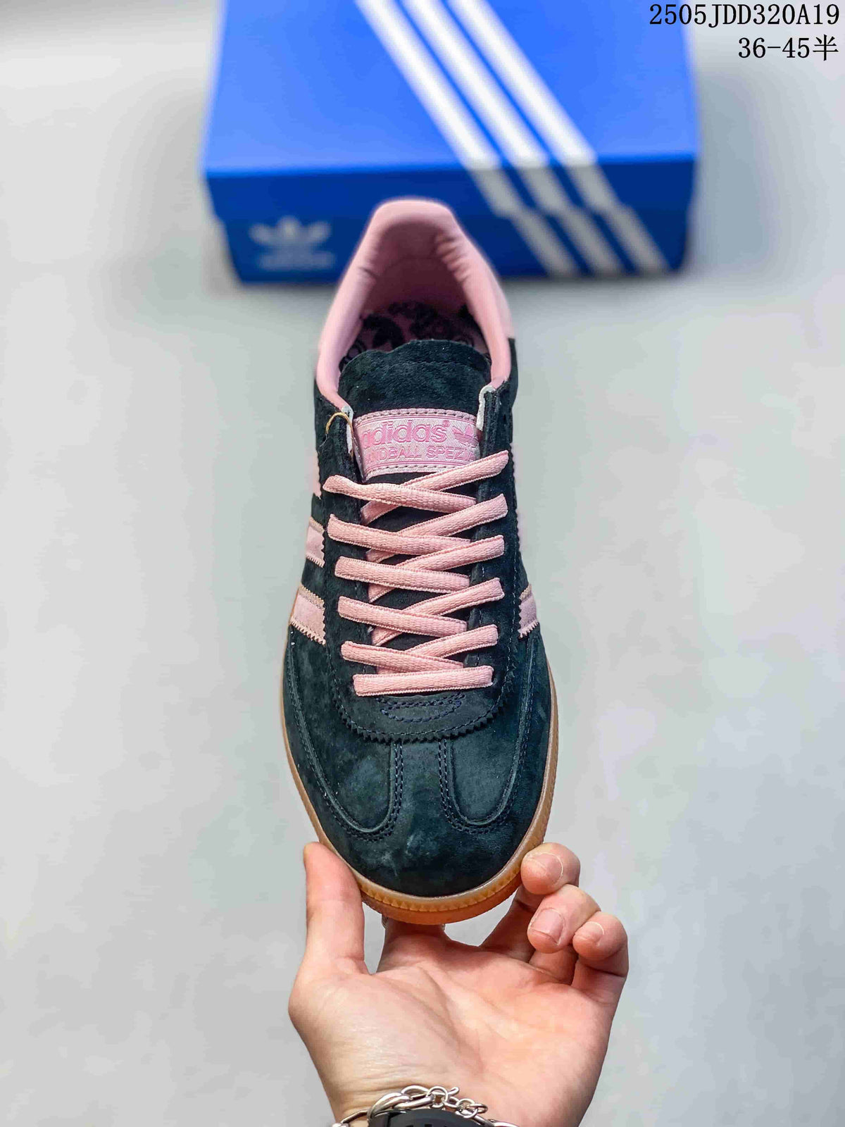Top view showing the black toe box, pink laces, and padded pink collar.