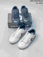 Group view showing black and white Converse low-top sneakers with star-and-chevron logos and shoebox packaging; image text shows style code 2607JDD439A19 and size range 35–44.5.
