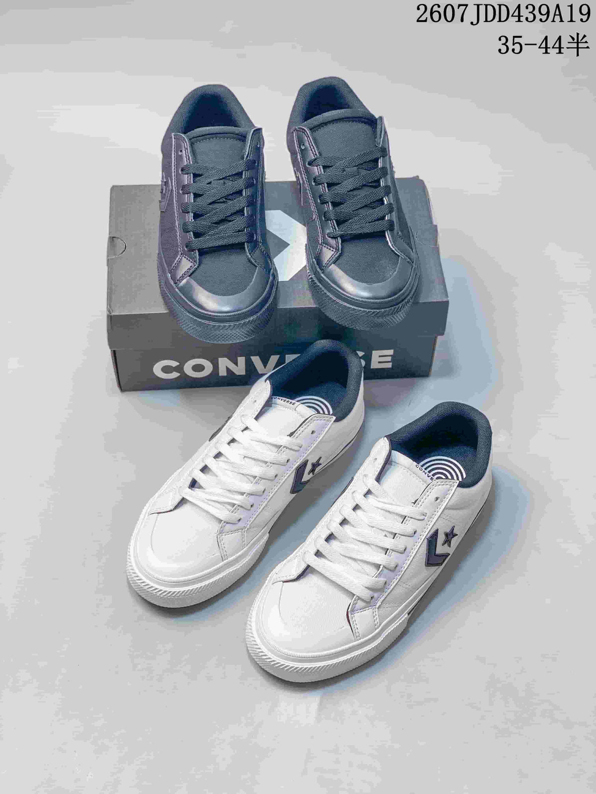 Group view showing black and white Converse low-top sneakers with star-and-chevron logos and shoebox packaging; image text shows style code 2607JDD439A19 and size range 35–44.5.