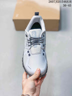Top view of the sneaker showing the light upper, dark laces, padded tongue and layered toe-panel design.