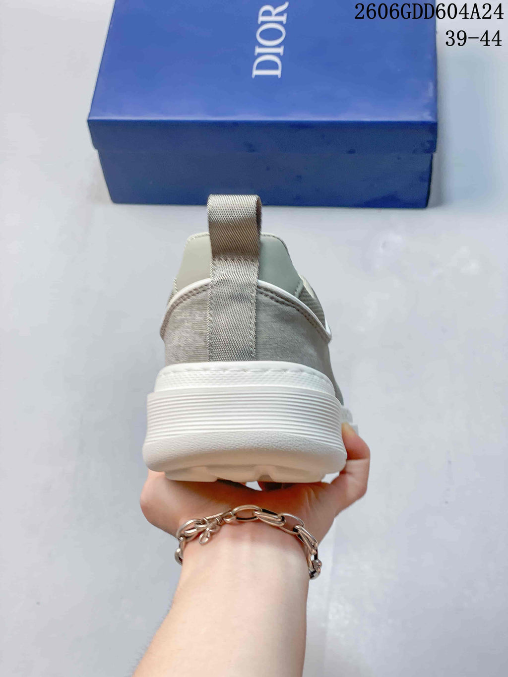 Rear view showing the heel pull tab and thick white sole