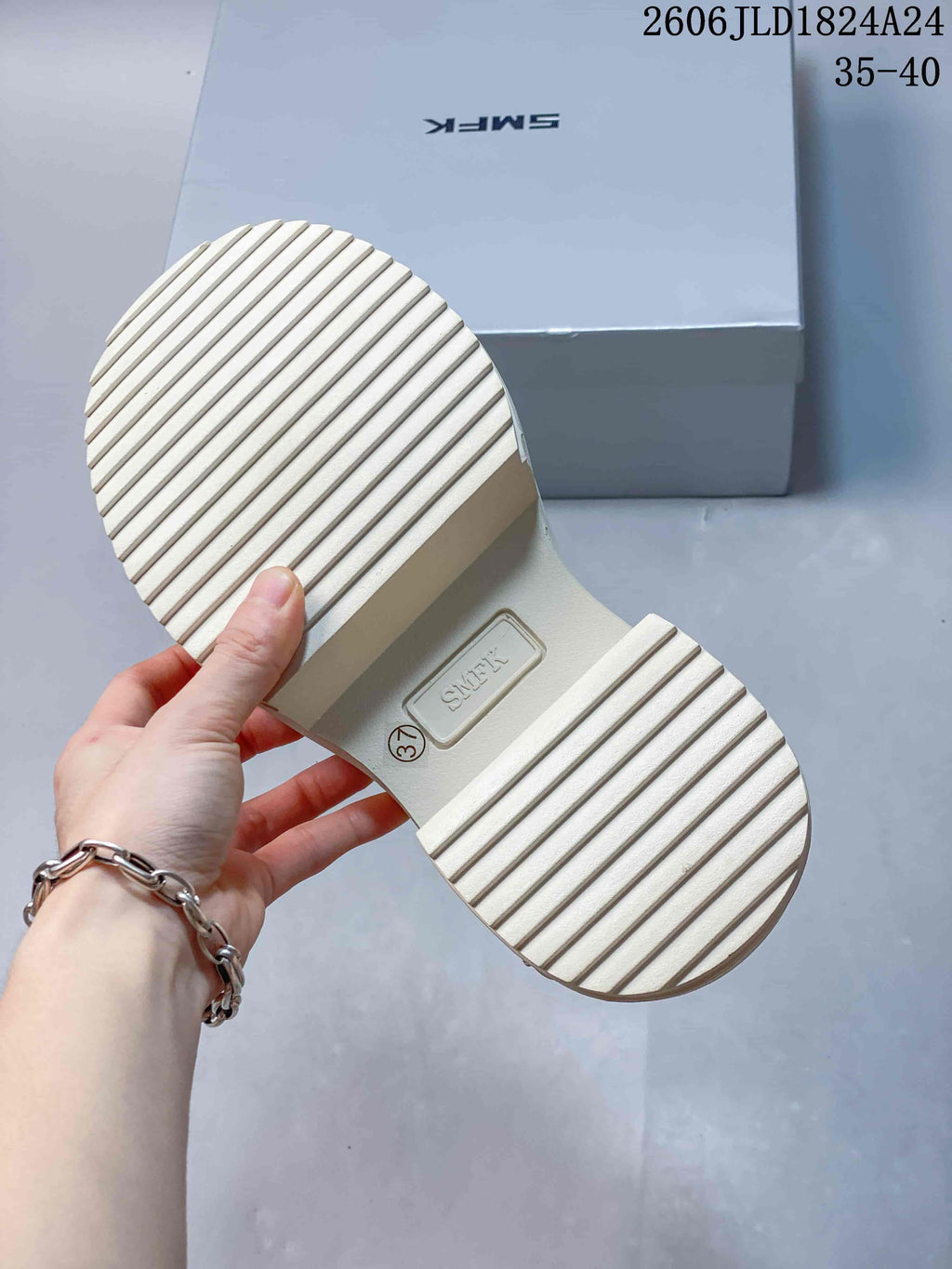 Underside of an ivory platform sole with a visible EU 37 sample marking