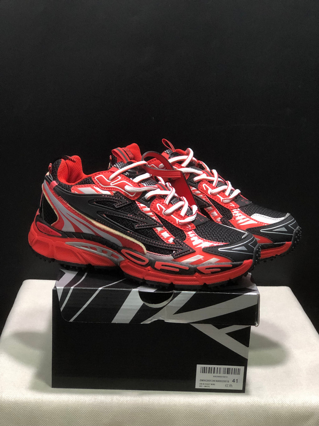 Pair of red, black, and white OFF-WHITE Be Right Back sneakers displayed on a branded-style shoe box; the box label shows size 41.