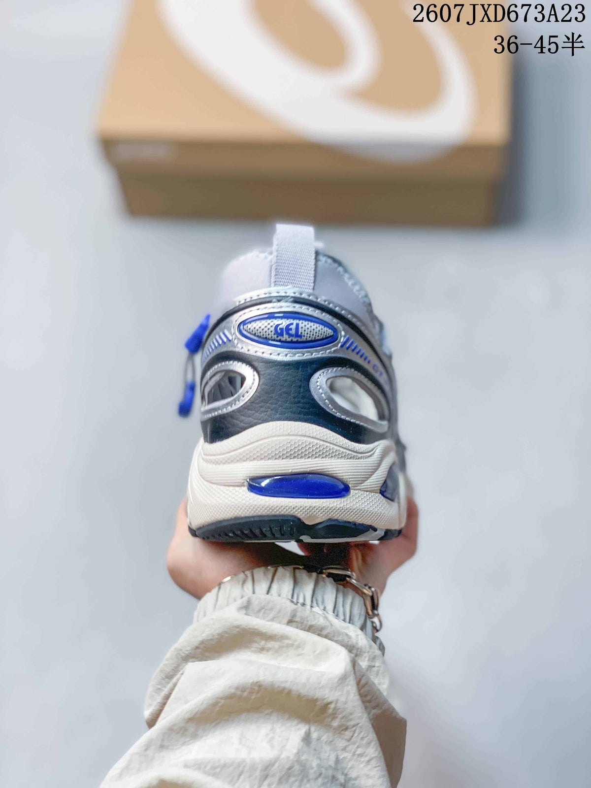Rear view of the sneaker showing the heel GEL detail, layered heel construction, and dark heel accents.