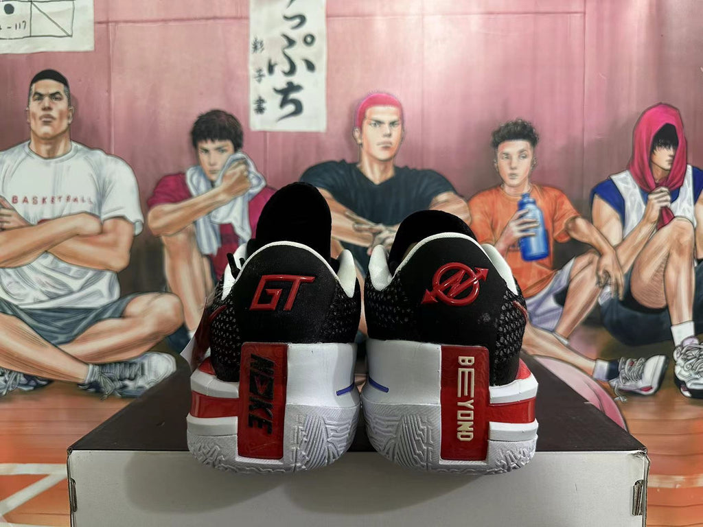 Rear view of black basketball shoes with red and white heel details