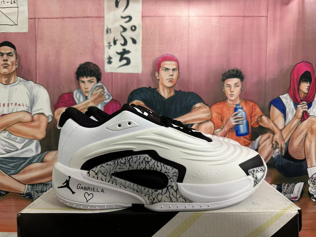Side view of a white and black Jordan Luka basketball shoe with patterned side detailing and a personalized heel graphic.