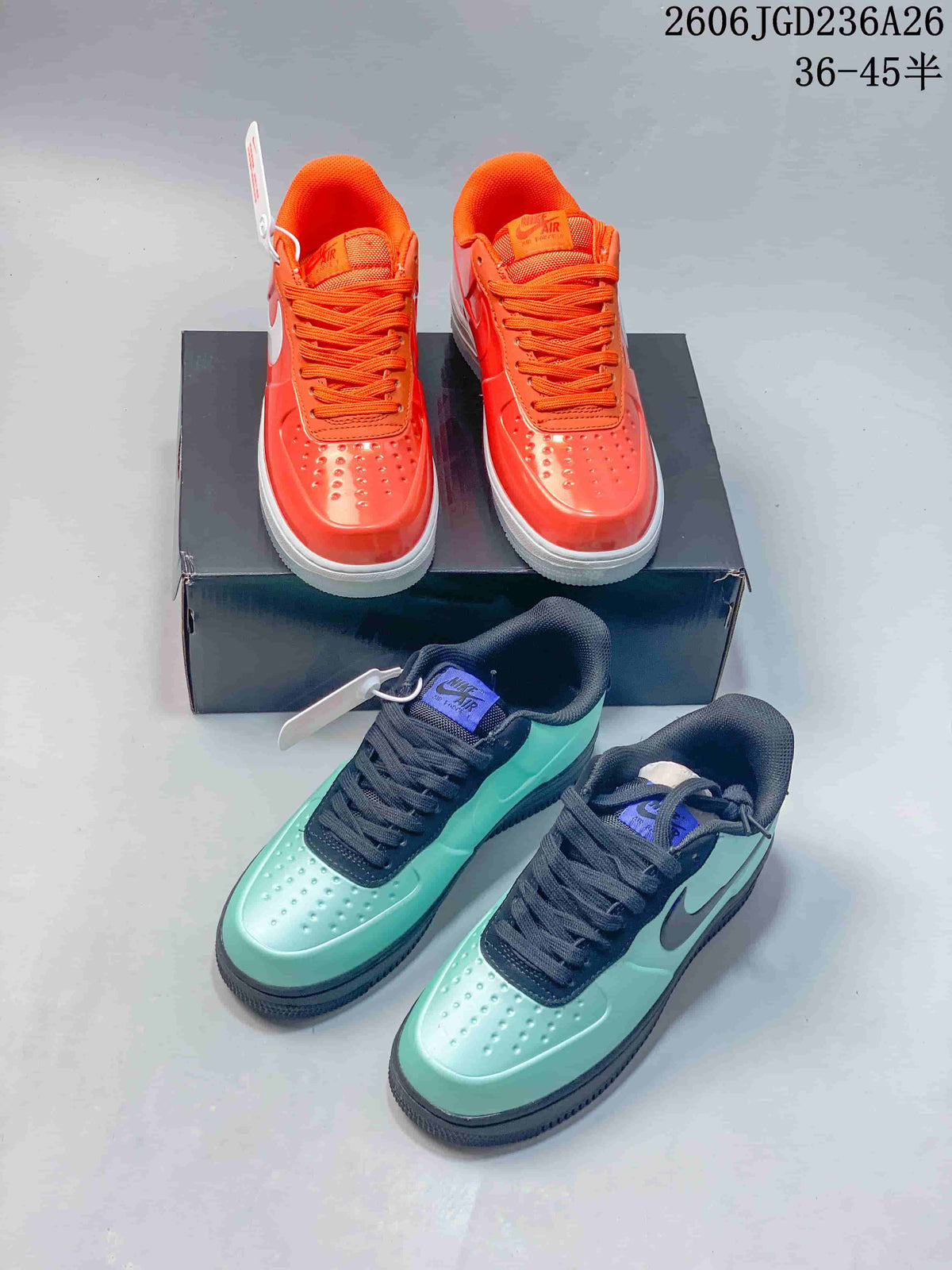 Orange and mint green pairs of low-top sneakers displayed together.