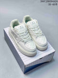 Pair of white MLB platform sneakers displayed on a shoebox, showing the front, laces, padded collars and raised soles.