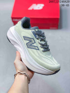 Angled side view of the pale green and gray lace-up running shoe with a white midsole.