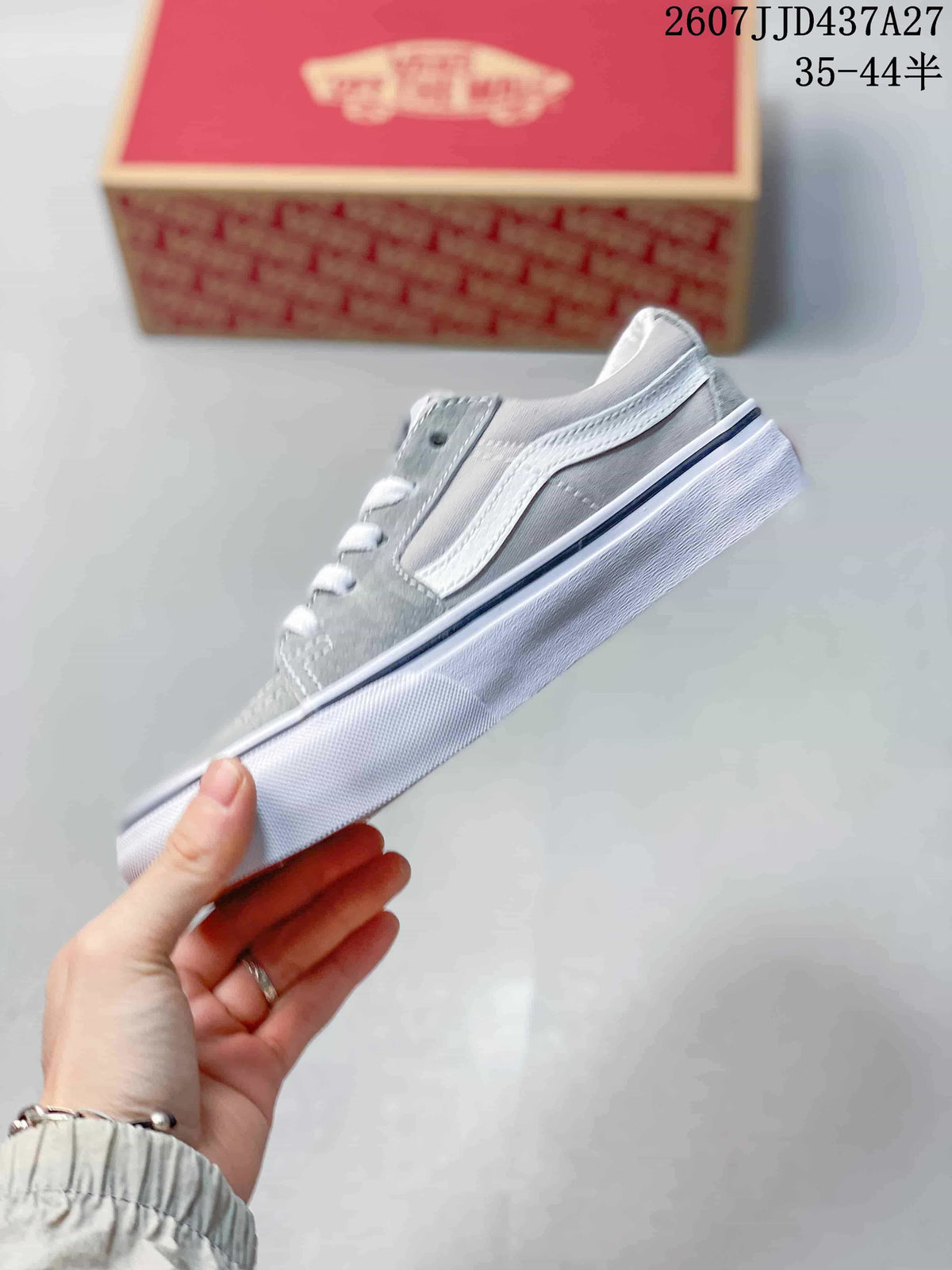 Side view showing the grey upper, white side stripe, padded collar and white sole.